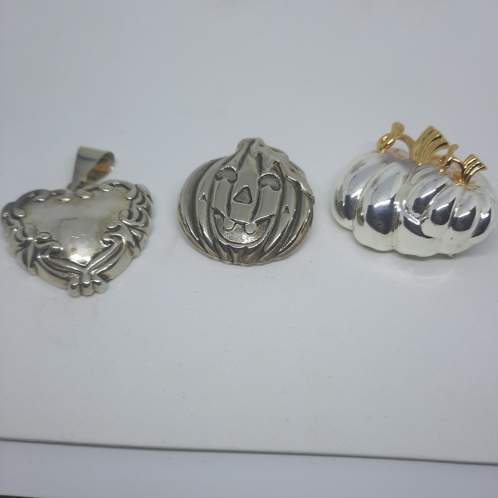 Brooches and pendent marked Best